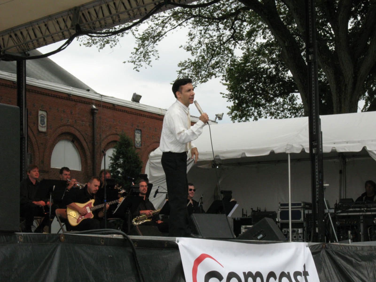 Chaz Esposito fronting the big band on an outdoor stage